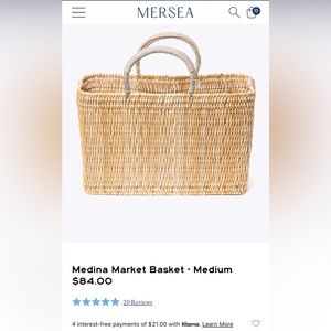 Mersey Medina Market medium basket tote with beige leather handles.